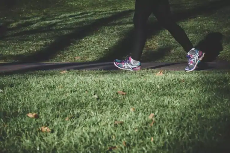 image of legs jogging in a park