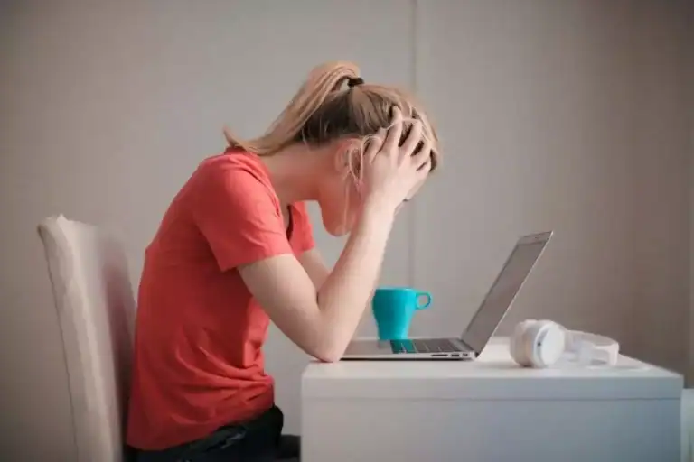 image of a stressed girl working on laptop