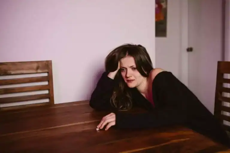 image of a depressed woman experiencing PTSD symptoms before ketamine infusions