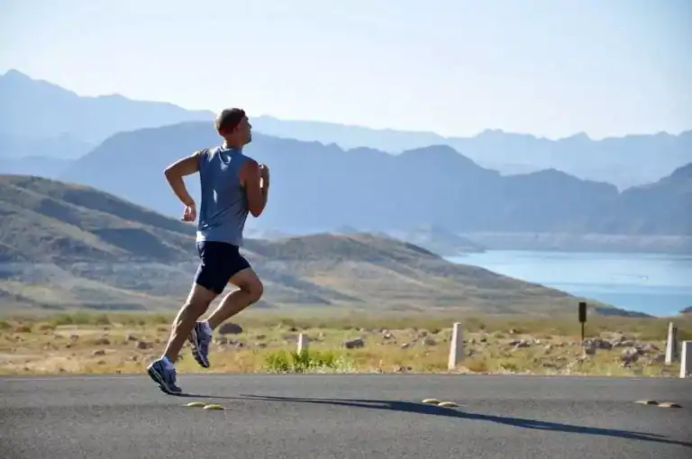 image of a man jogging outdoors, practicing healthy lifestyle choices with ketamine infusions