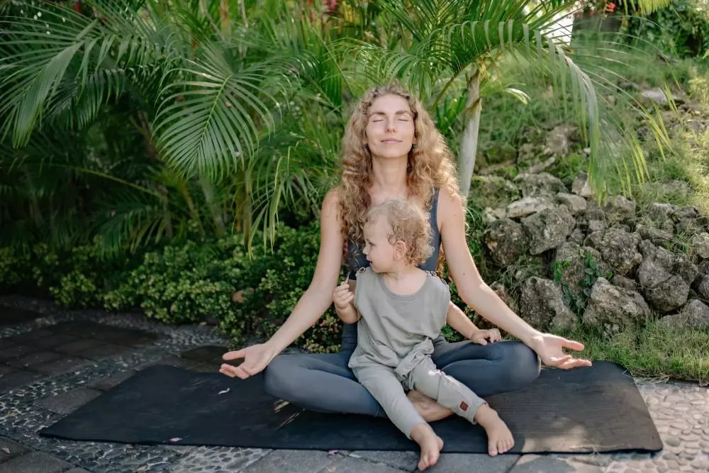 image of a woman with her child doing yoga