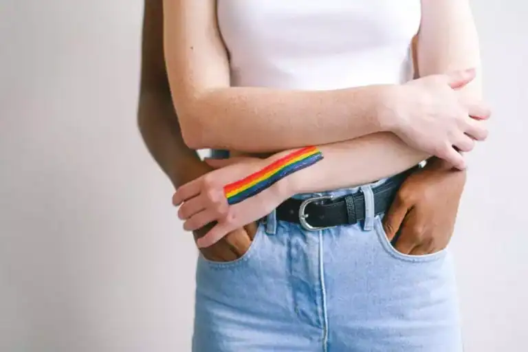 image of LGBTQ+ couple hugging each other