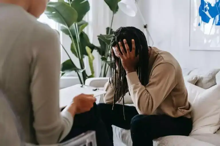 image of a therapist interviewing a patient with PTSD and ketamine infusion therapy