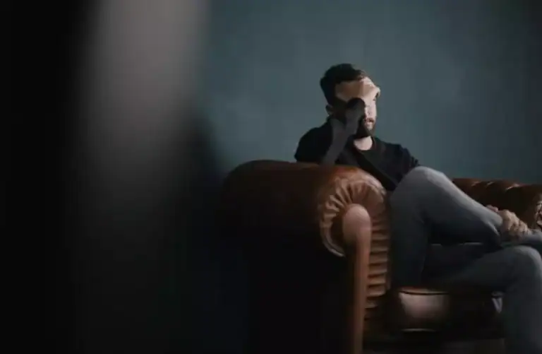 image of a seated and anxious man discussing ketamine infusions at therapy