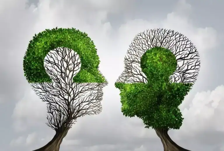 image of two silhouettes of a couple complementing each other in the shape of a tree representing wellness and holistic care