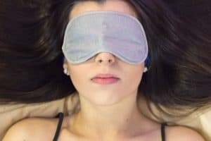 woman with an eye mask over her eyes