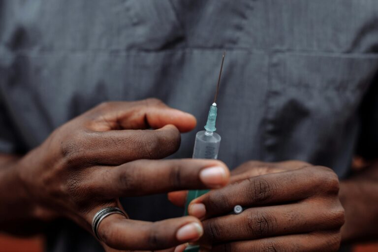 nurse holding a syringe before administering safe and legal ketamine to a patient