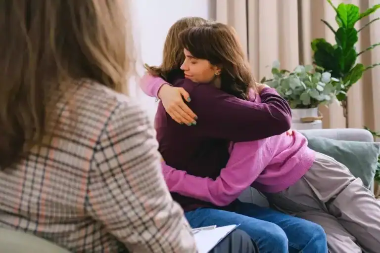 image of women hugging each other to convey confidence and security during ketamine integration therapy