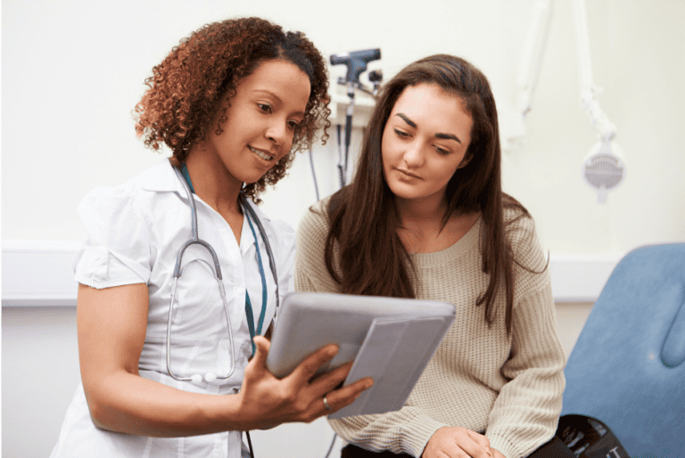 Ketamine nurse and patient reviewing chart and details about ketamine infusions in DC, Virginia, and Maryland
