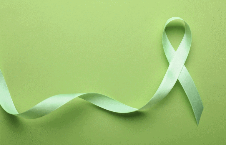 green ribbon with green background for mental health awareness