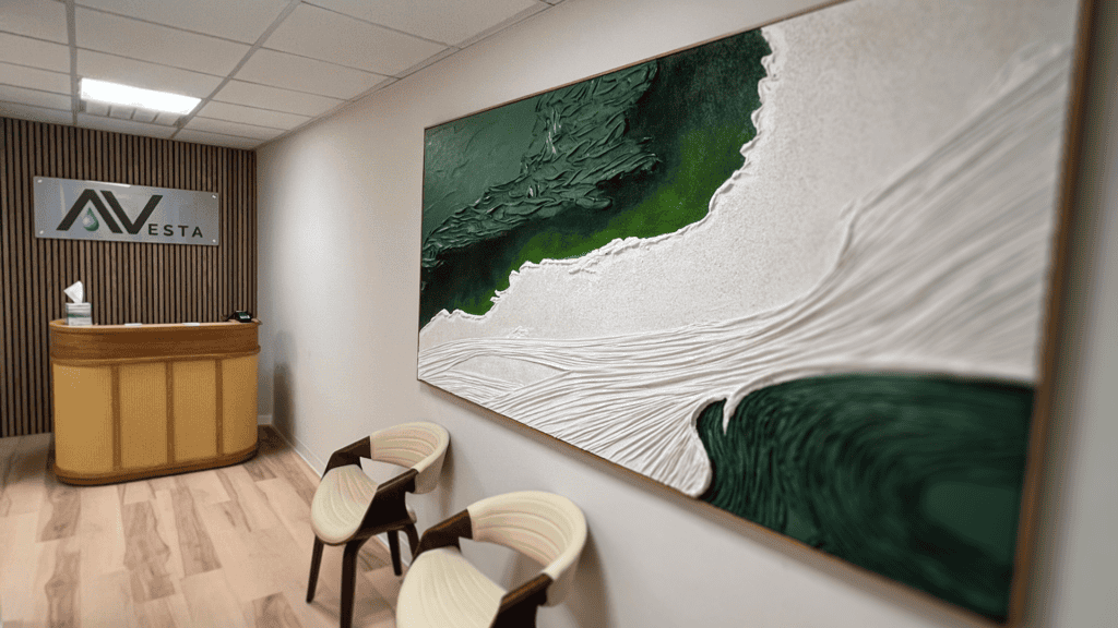 Lobby entrance of Avesta Ketamine & Wellness Norfolk clinic with reception desk, seating, and calming wall art